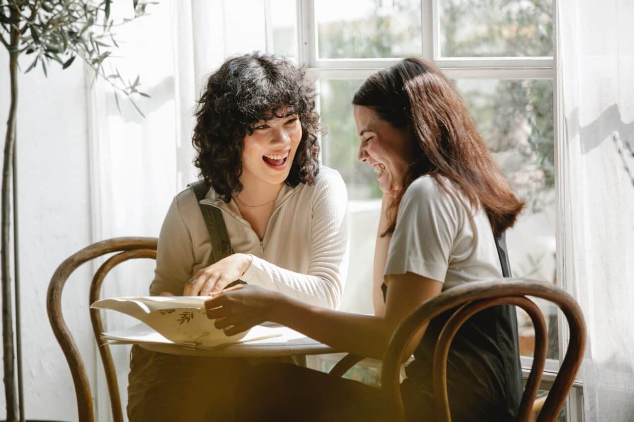 two people having a conversation at a table