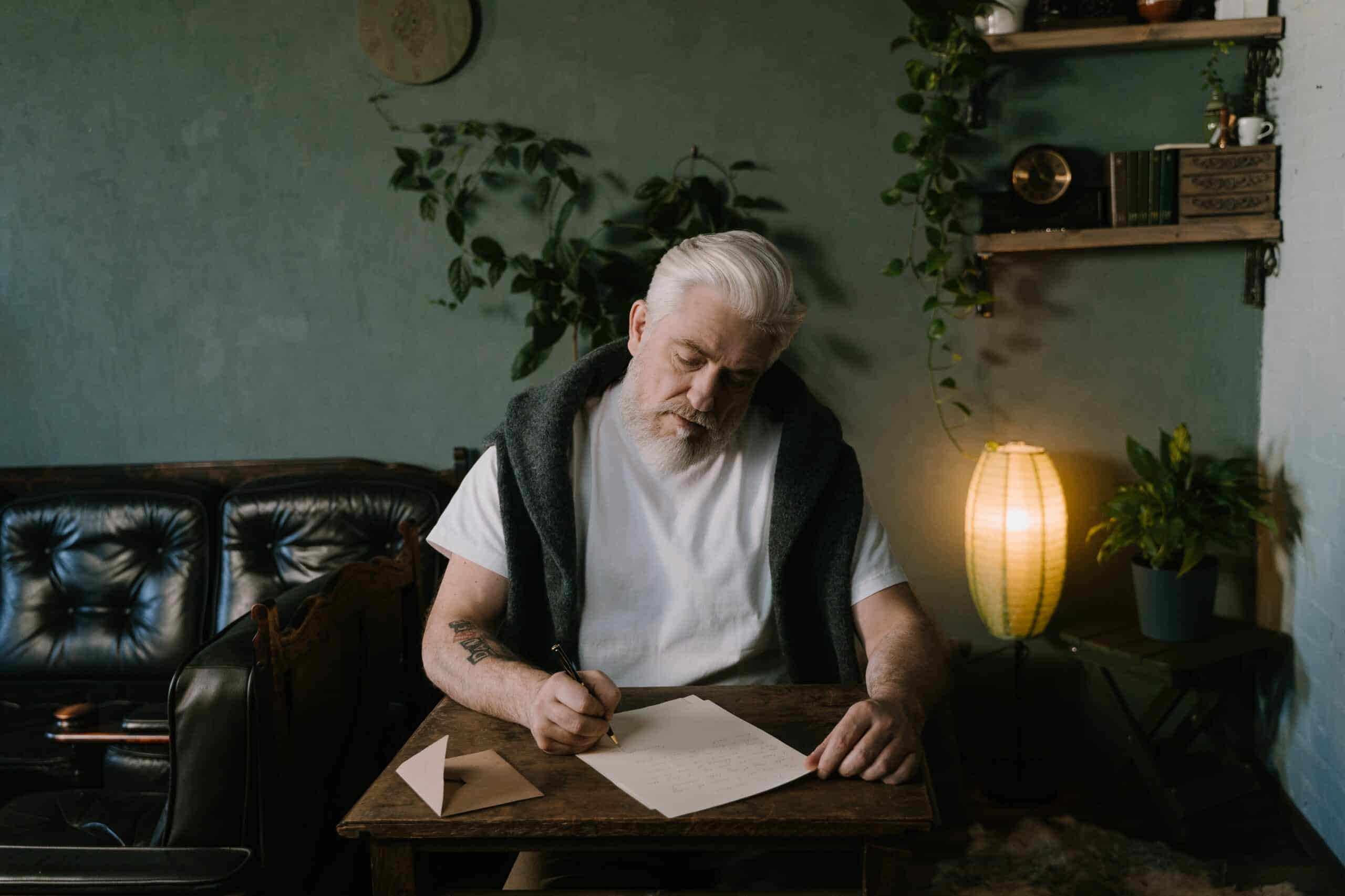 writer writing at his desk